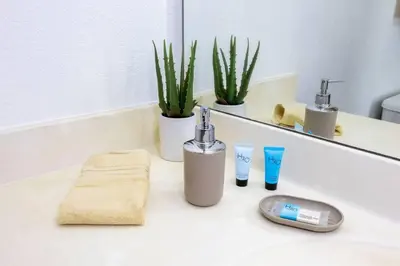 a bathroom counter with a sink with a faucet at Your Orlando home 15 min to Disney - KGG01 in Kissimmee