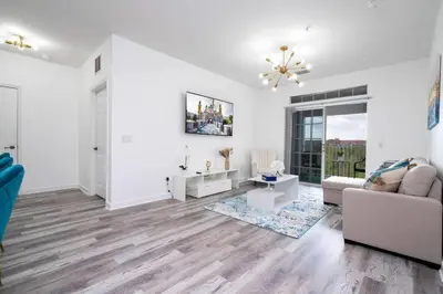 a living room with a couch and a table at Your Orlando home 15 min to Disney - KGG01 in Kissimmee