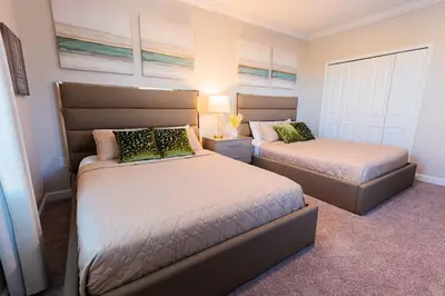 a bedroom with two beds in a room at Modern Adventure Home near to Disney in Kissimmee