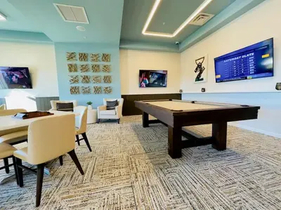 a gaming room with a pool table and a tv at Magical Themed Home - Disney 15 min in Kissimmee