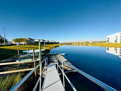 a dock with boats parked on the water at 6BR Disney Oasis with Pool, Game Room and Resort in Kissimmee