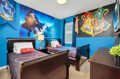 a bedroom with a captain america mural on the wall at Serene Sunsets Villa - E04 in Kissimmee