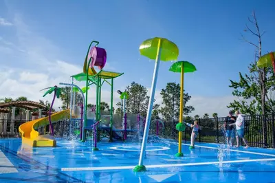 a water park with a water slide and fountains at One in a Minion #102 in Orlando