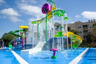 a pool with a water park with a water slide at Mickey Mouse #104 in Orlando