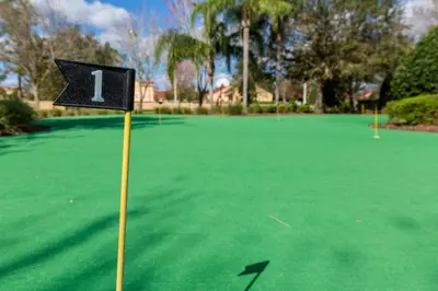a golf course with a sign on a putting green at Windsor Hills Resort #202 in Orlando