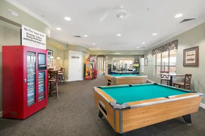 a billiard room with a pool table and a machine at Windsor Hills Resort #202 in Orlando