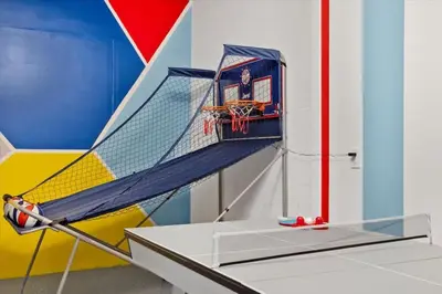 an indoor basketball hoop with a net in a room at Modern Resort House Pool Wi-Fi Minutes to Disney in Kissimmee