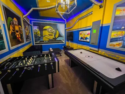 a game room with two ping pong tables at 5BR Villa with Game Room and Spa, 12 Min to Disney in Kissimmee