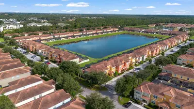 an aerial view of a suburb with a large lake at Amazing 5BD and 4BH 6 miles from Disney in Kissimmee