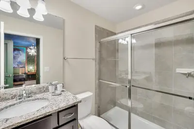 a bathroom with a shower and a sink at Many Themes For Everyone 10 Huge Bedrooms! villa in Kissimmee