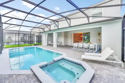 an indoor swimming pool with a glass ceiling at Many Themes For Everyone 10 Huge Bedrooms! villa in Kissimmee