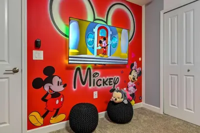 a mickey mouse wall mural in a childs room at Brand New Corner Lot Pond View Vacation Home in Kissimmee