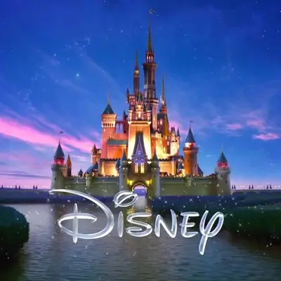 a disney castle in the water at night at Spacious 4 bed 3 bath Townhome with pool 5 STARS!! in Kissimmee