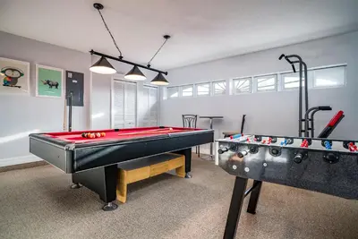 a room with a ping pong table and two pool tables at Luxury Villa! Fun in the Sun! Formosa Gardens in Orlando