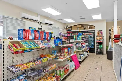 a store aisle of a grocery store with food at Mickey's Hideaway Windsor Hills Resort in Orlando