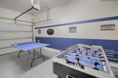 a room with a ping pong table at 5134 Compass Bay in Kissimmee