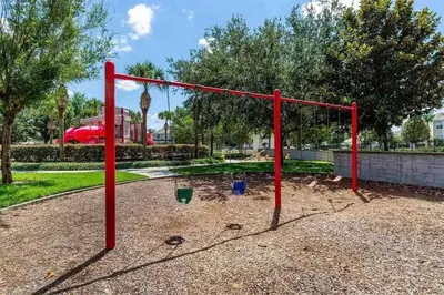 a red monkey bars in a playground at Minutes to Disney, Free Water Park & Private Pool in Orlando