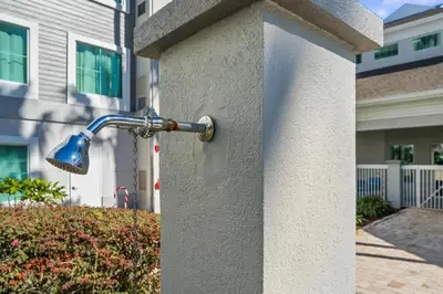 a water fountain on the side of a building at 1BR FREE Shuttle to Disney Parks HS305 in Orlando