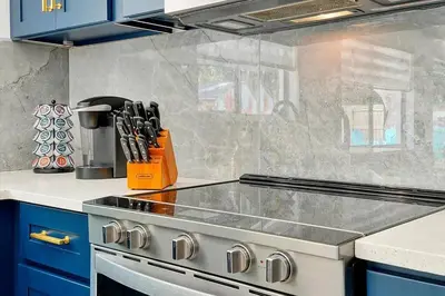 a kitchen with a stove and a counter top at Private Villa/Outdoor Oasis in Kissimmee