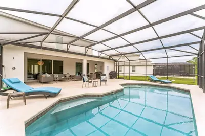 an outdoor pool with a pergola and a patio at 65 Home At Sonoma Resort, Private Pool, And Much More!! in Kissimmee