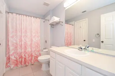 a bathroom with a sink and a toilet at Under The Sea Villa villa in Orlando