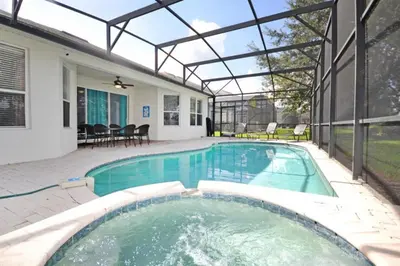 a swimming pool in a house with a glass roof at Under The Sea Villa villa in Orlando