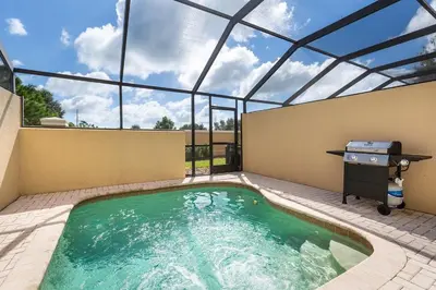 a swimming pool on the roof of a house at Charming 3BR Townhome Private Pool Walk to Clubhouse 9 Min Disney in Orlando