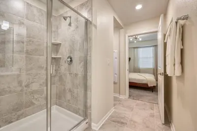 a bathroom with a shower and a walk in shower at Lake View - 10 min to Disney Storey Lake Resort in Kissimmee